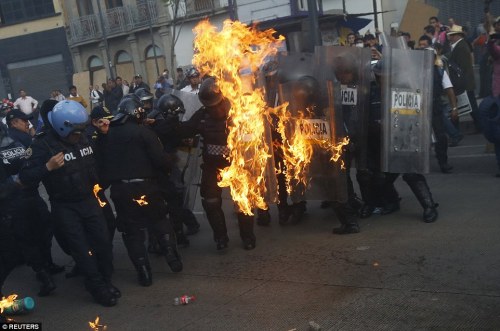 2918E67D00000578-3098775-Violence_Protesters_threw_Molotov_cocktails_at_police_eight_mont-a-24_1432715462705